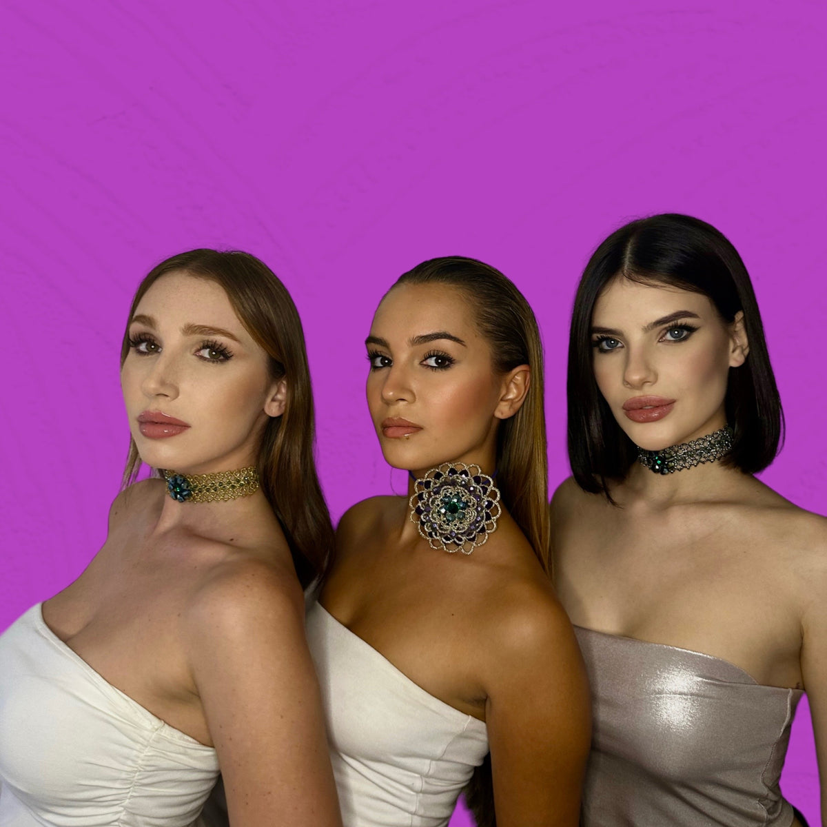 Tutti i Gioielli collection featuring three models wearing stunning choker necklaces against a vibrant purple background.