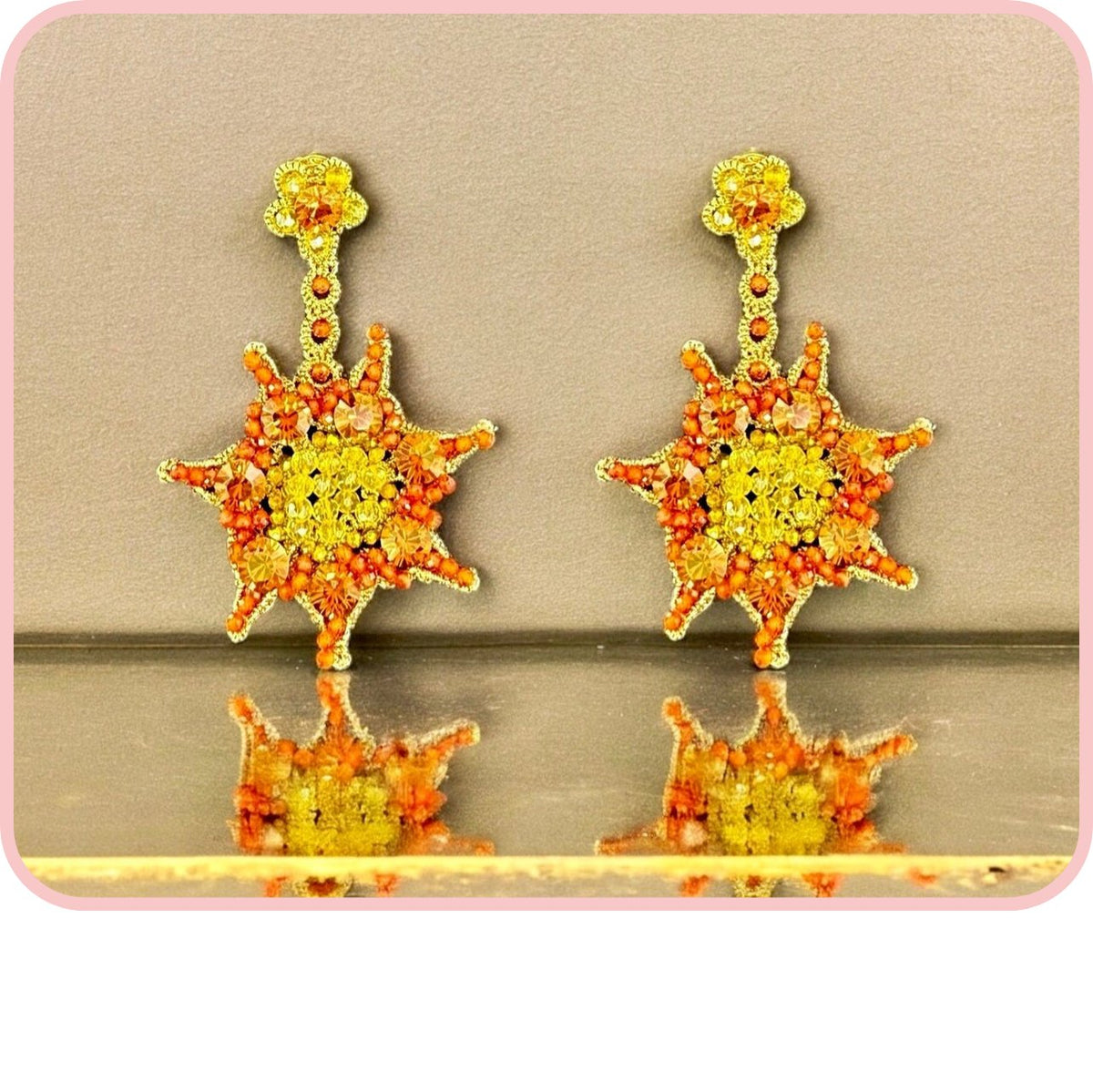 Colorful sun-themed earrings from the Elements collection with intricate beadwork.
