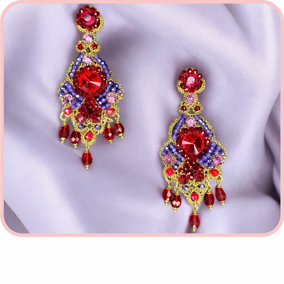 Elegant red and purple earrings from the Evergreen collection, featuring intricate designs and sparkling gemstones.